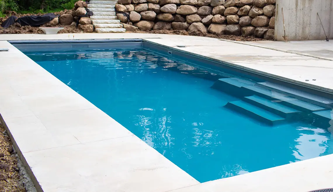 Leisure Pools The Grand rectangular fiberglass pool side view by Leisure Pools Northwest Ohio